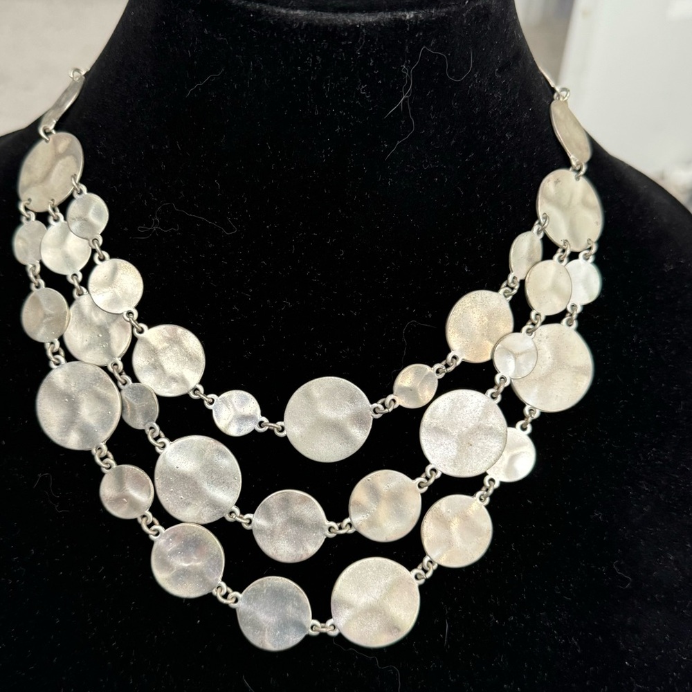 Silver toned three strand bib necklace